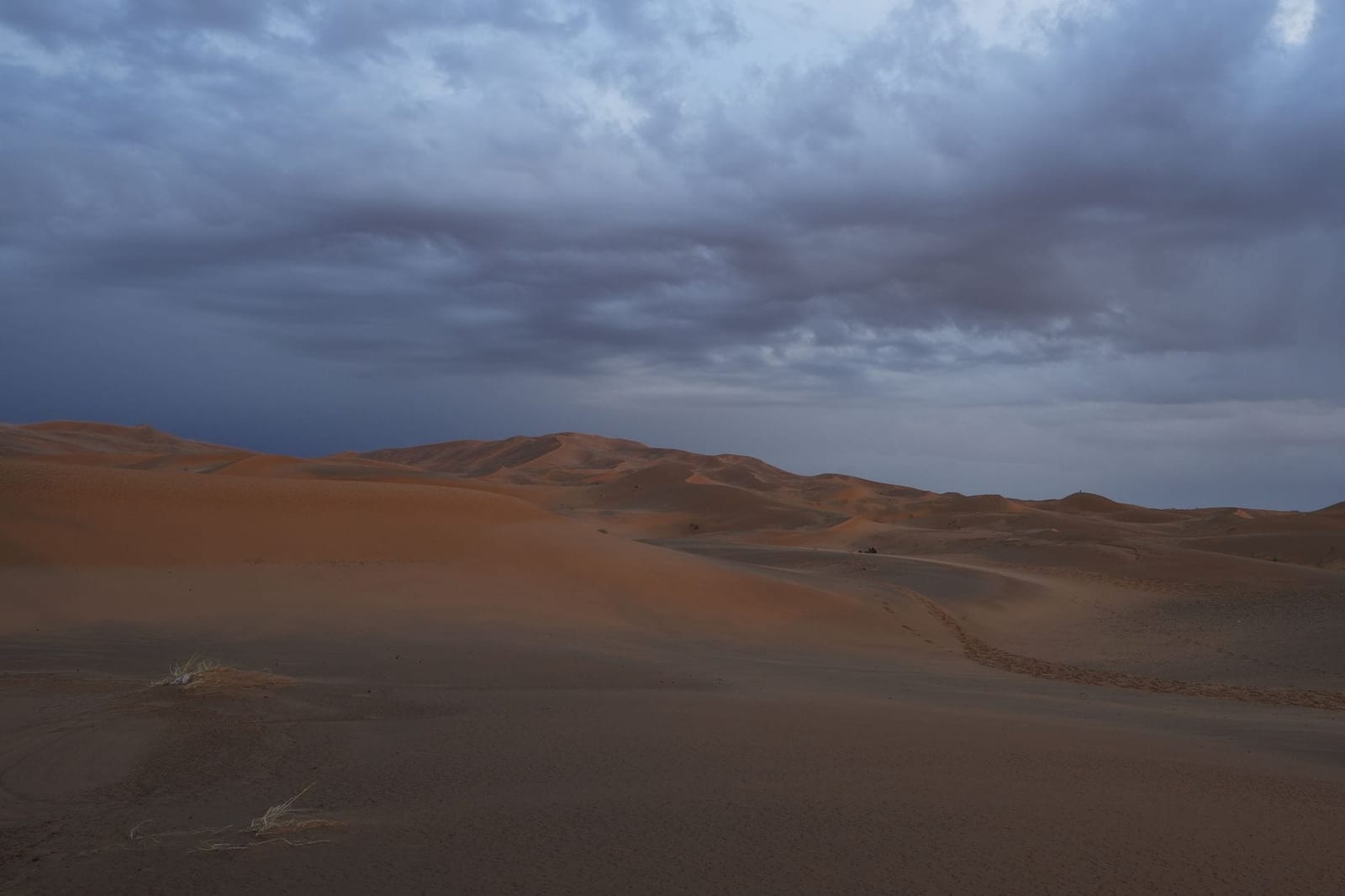 Merzouga dunes under a dramatic twilight sky