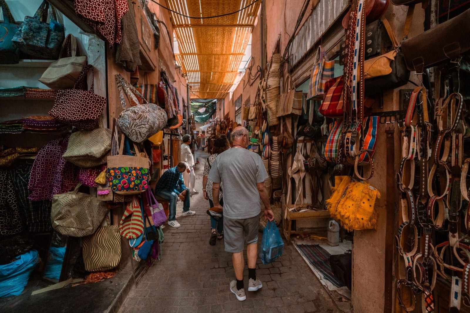 A narrow souk alley lined with lanterns in Marrakech