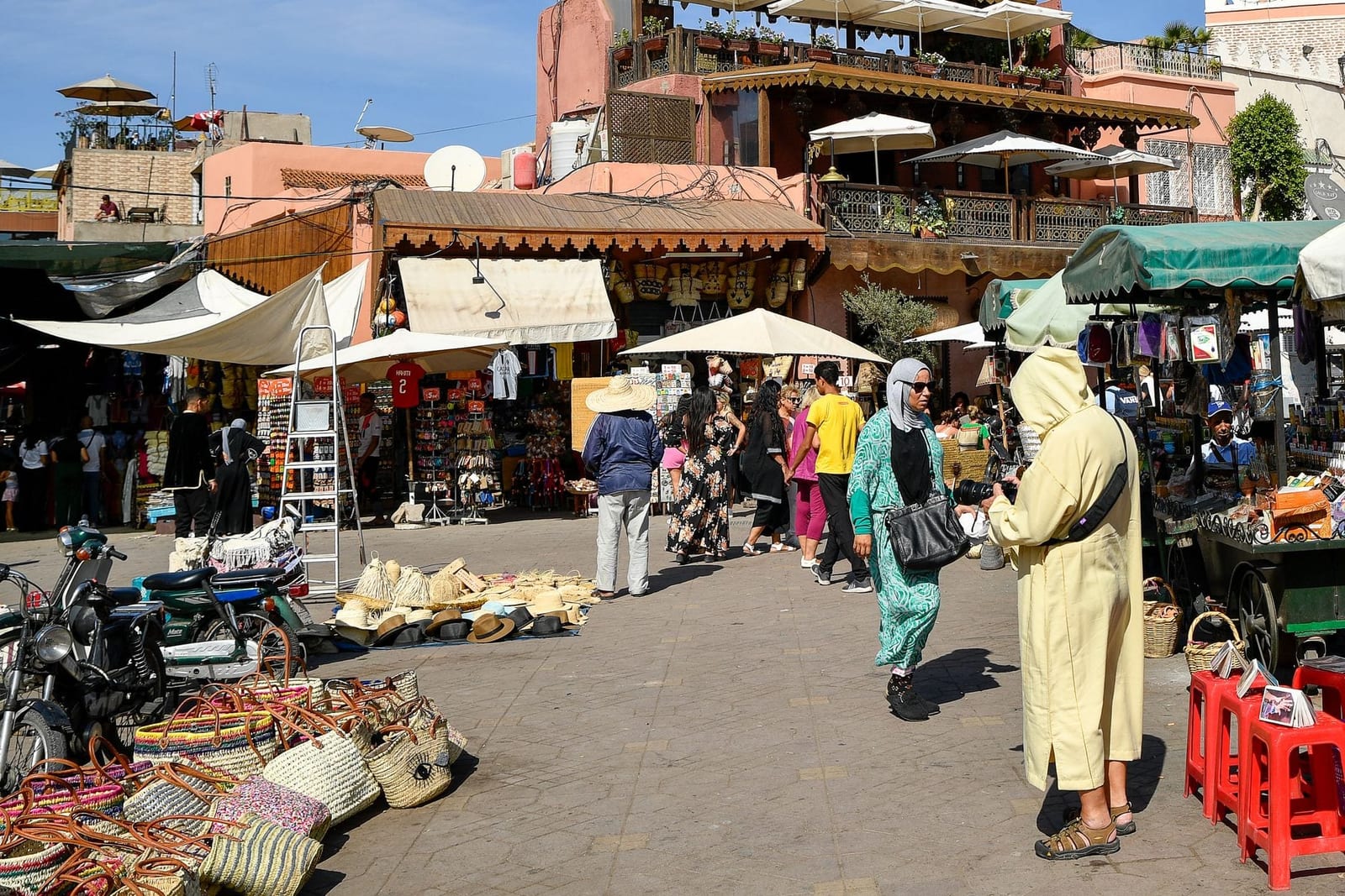 Shopper walking through a covered market street in Marrakech